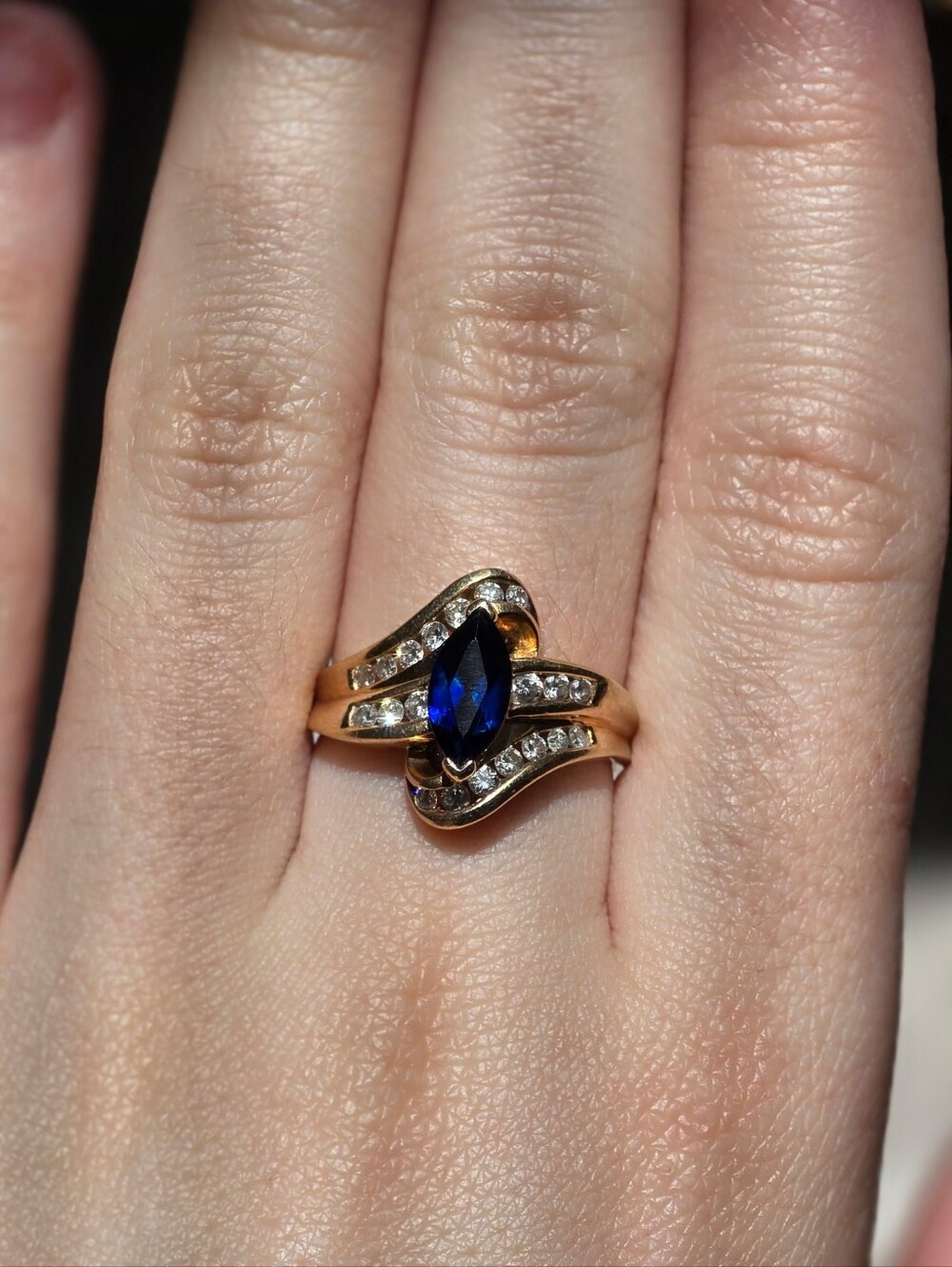 Gold Ring with Blue Marquise Sapphire and Diamond Accents